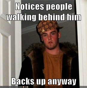 Notices people walking behind him  Backs up anyway