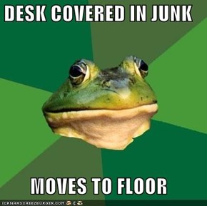 DESK COVERED IN JUNK  MOVES TO FLOOR