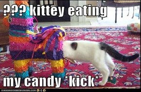 ??? kittey eating  my candy *kick*